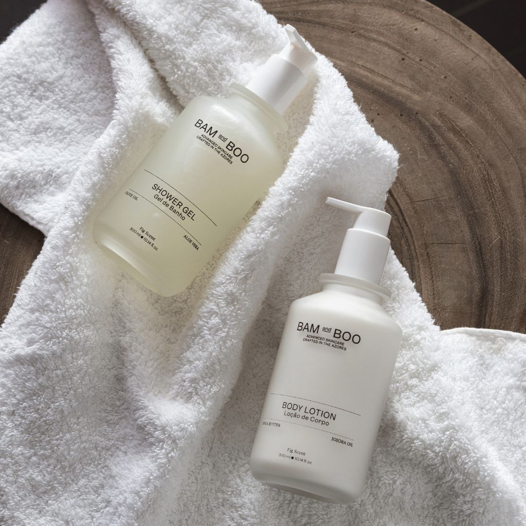 Bam and Boo shower gel and body lotion on a white towel. Natural Premium Amenities.